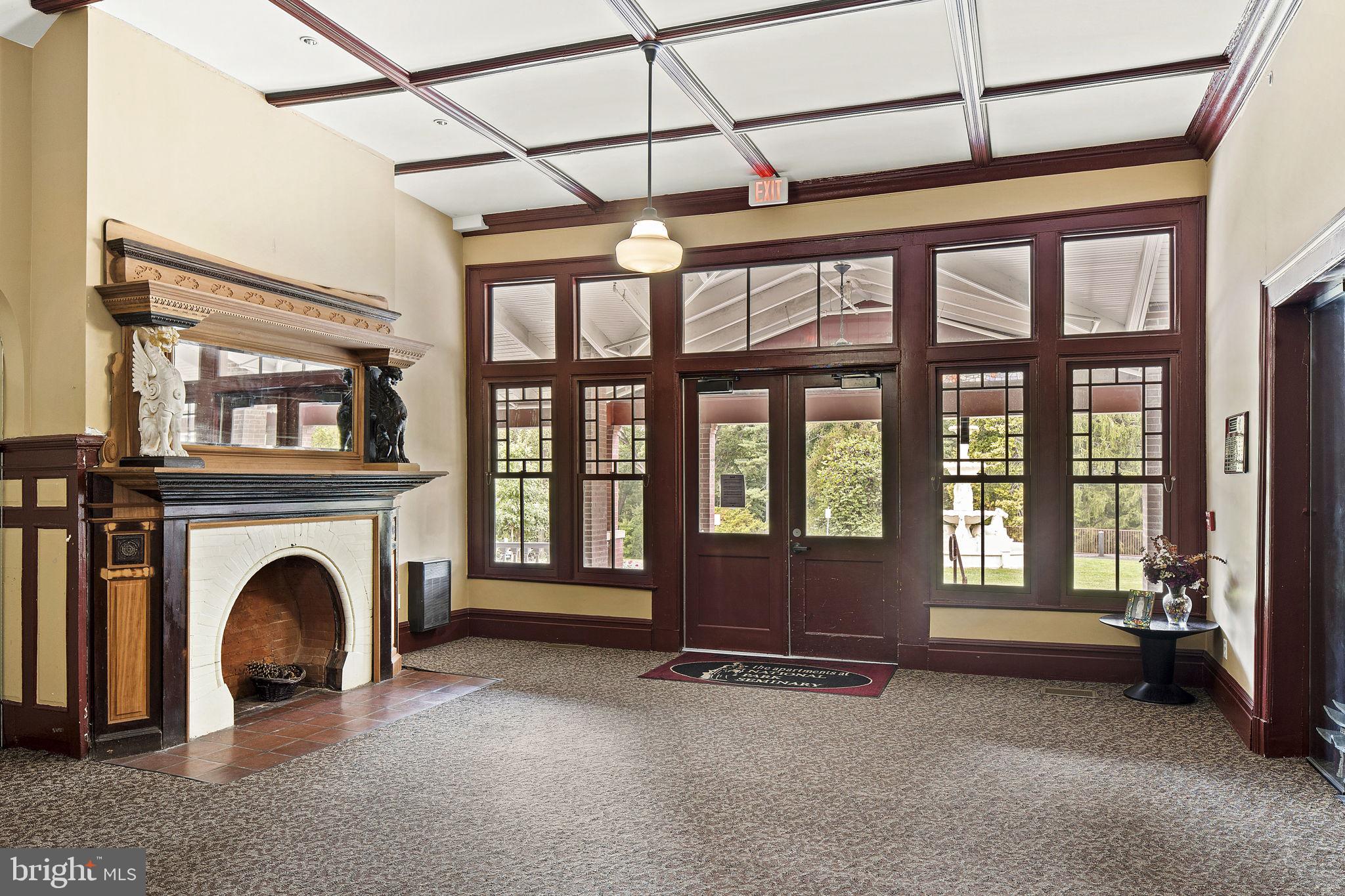 9610 Dewitt Drive, Unit PH204 Silver Spring, MD 20910 - Photo 38 of 42 a view of an entryway with a fireplace