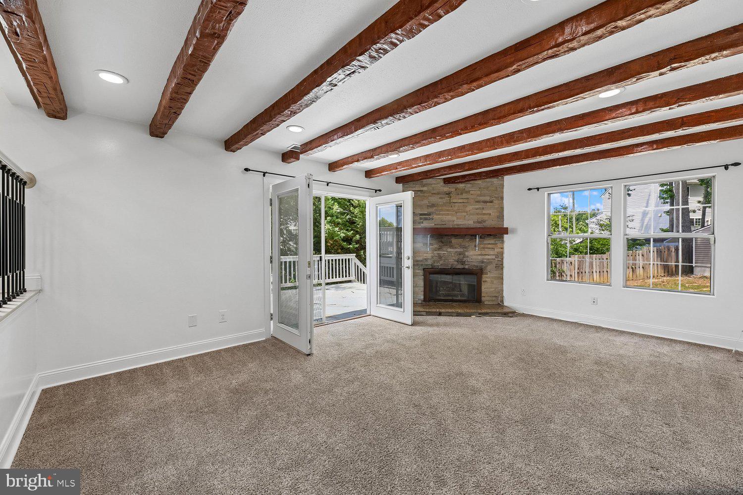 15764 Beau Ridge Drive Woodbridge, VA 22193 - Photo 14 of 58 a view of an empty room with a fireplace and a window