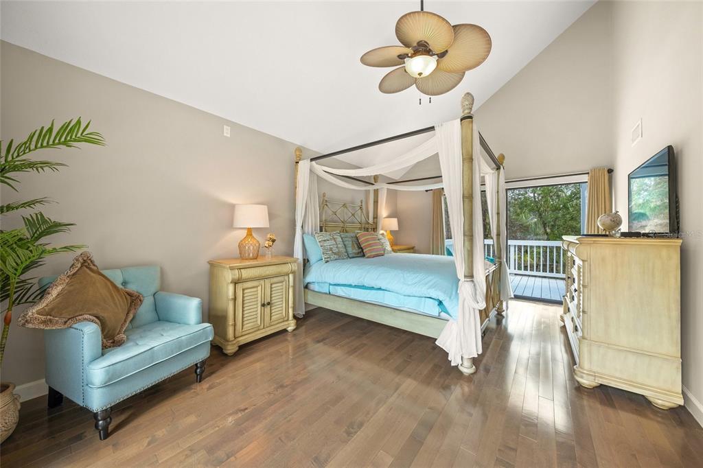 1256 Riegels Landing Drive Sarasota, FL 34242 - Photo 15 of 40 a bedroom with furniture and a chandelier