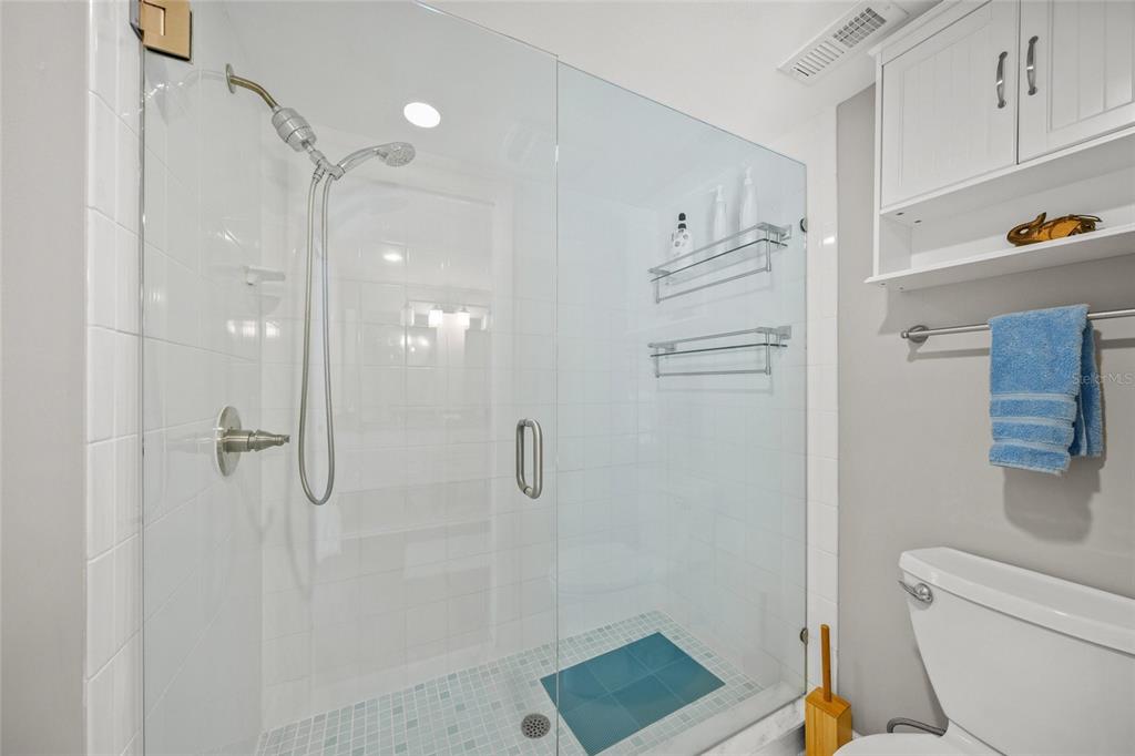 1256 Riegels Landing Drive Sarasota, FL 34242 - Photo 17 of 40 a bathroom with a shower a toilet and sink