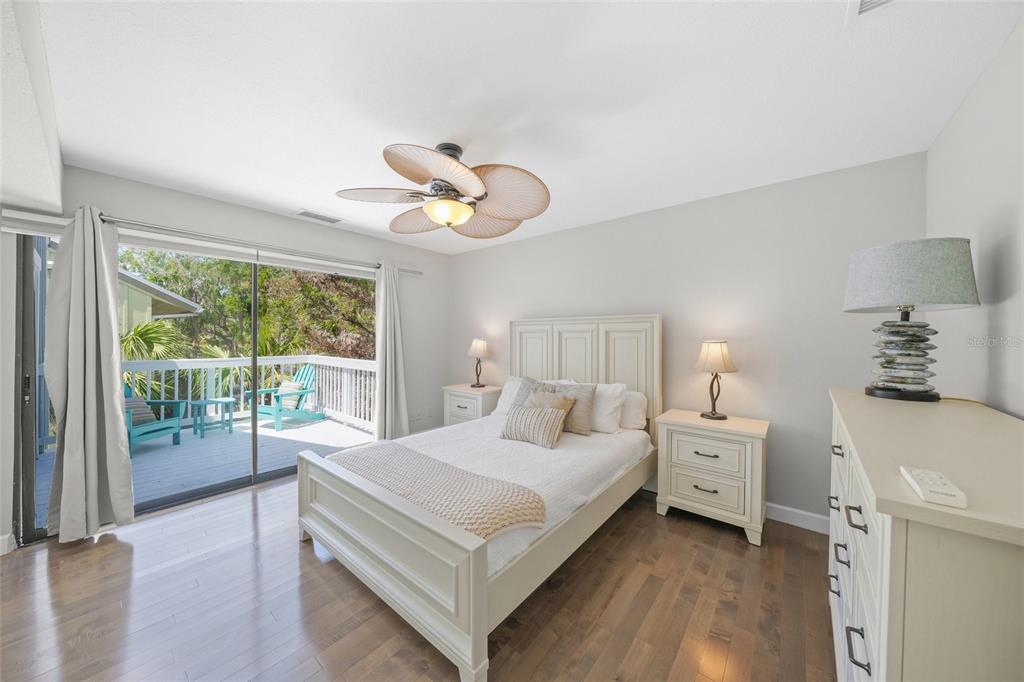 1256 Riegels Landing Drive Sarasota, FL 34242 - Photo 20 of 40 a bedroom with a bed and a large window