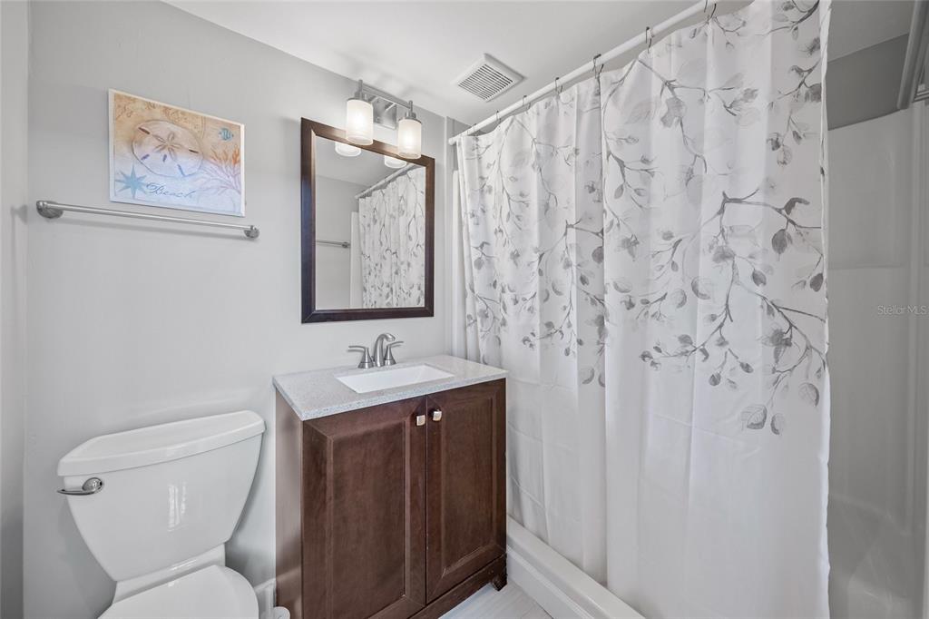 1256 Riegels Landing Drive Sarasota, FL 34242 - Photo 24 of 40 a bathroom with a toilet sink and vanity