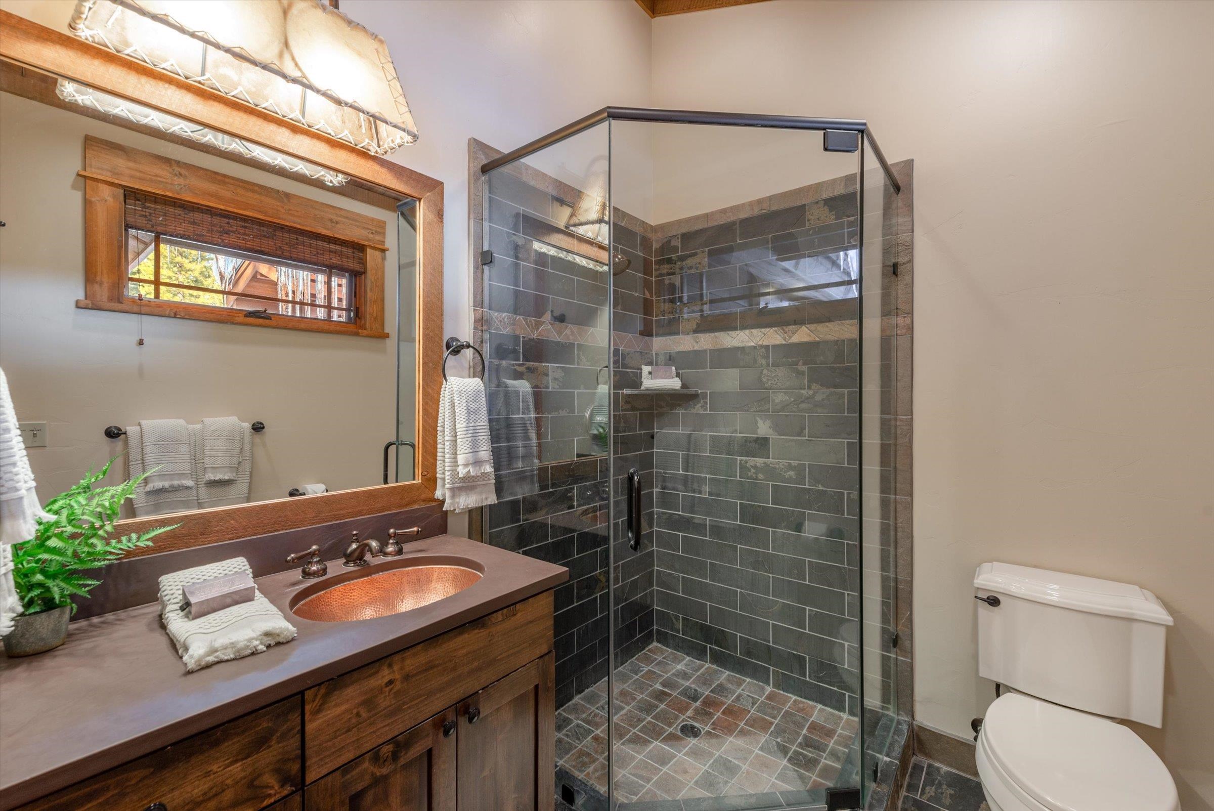 1756 Grouse Ridge Road Truckee, CA 96161 - Photo 11 of 21 a bathroom with a sink a toilet a mirror and shower