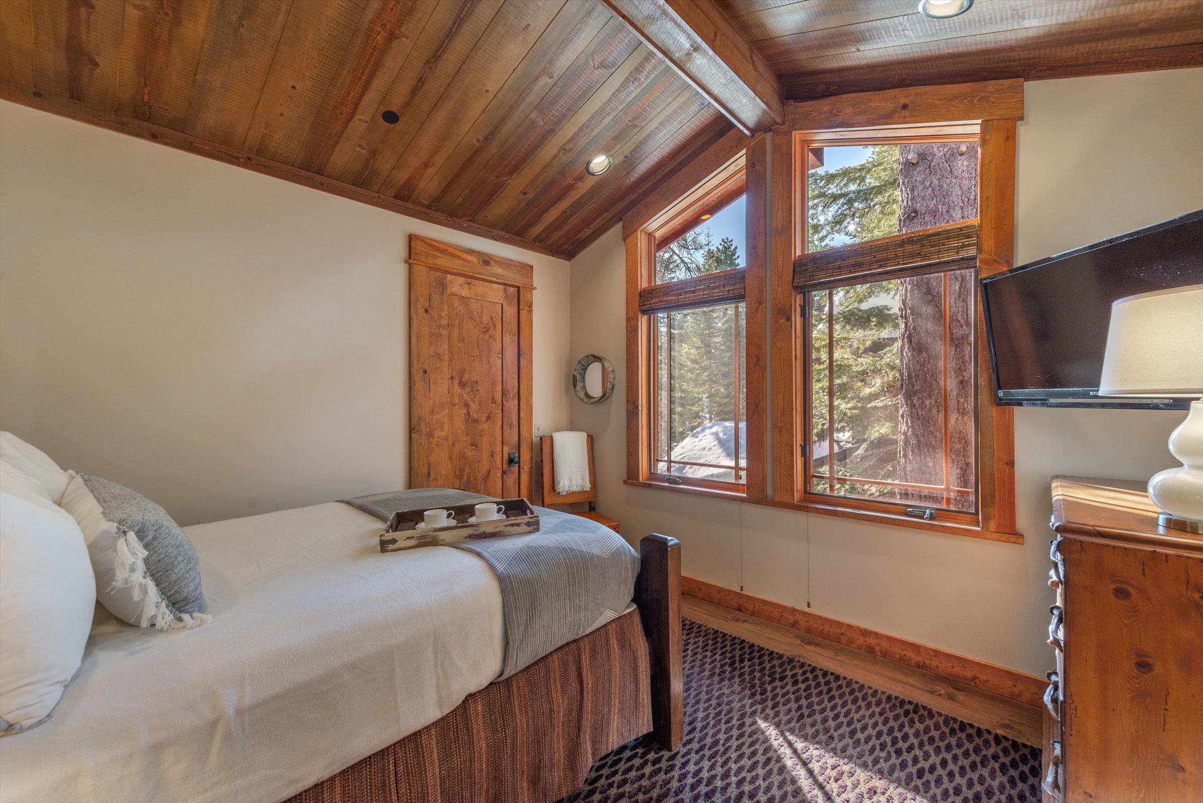 1756 Grouse Ridge Road Truckee, CA 96161 - Photo 12 of 21 a bedroom with a bed and a window with chair