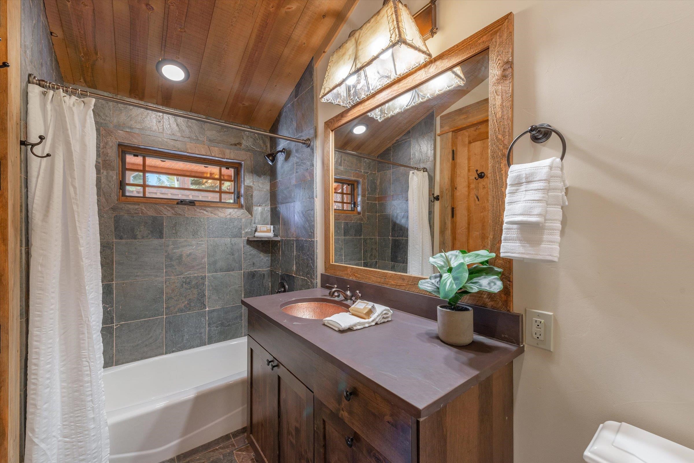 1756 Grouse Ridge Road Truckee, CA 96161 - Photo 13 of 21 a bathroom with a tub shower and sink