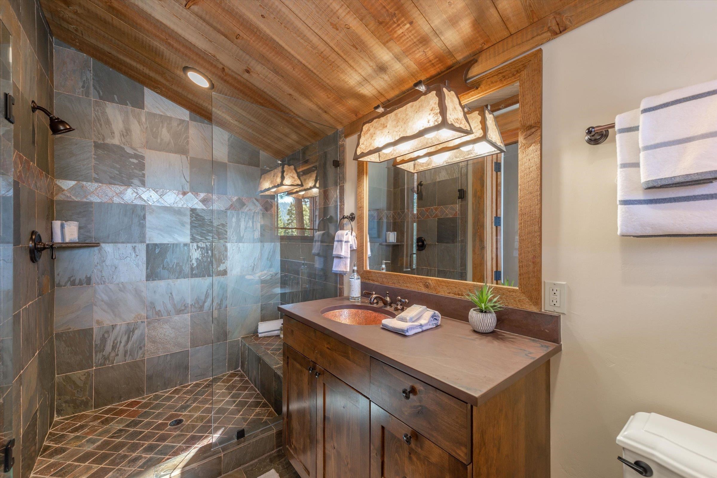 1756 Grouse Ridge Road Truckee, CA 96161 - Photo 15 of 21 a bathroom with a sink and a mirror