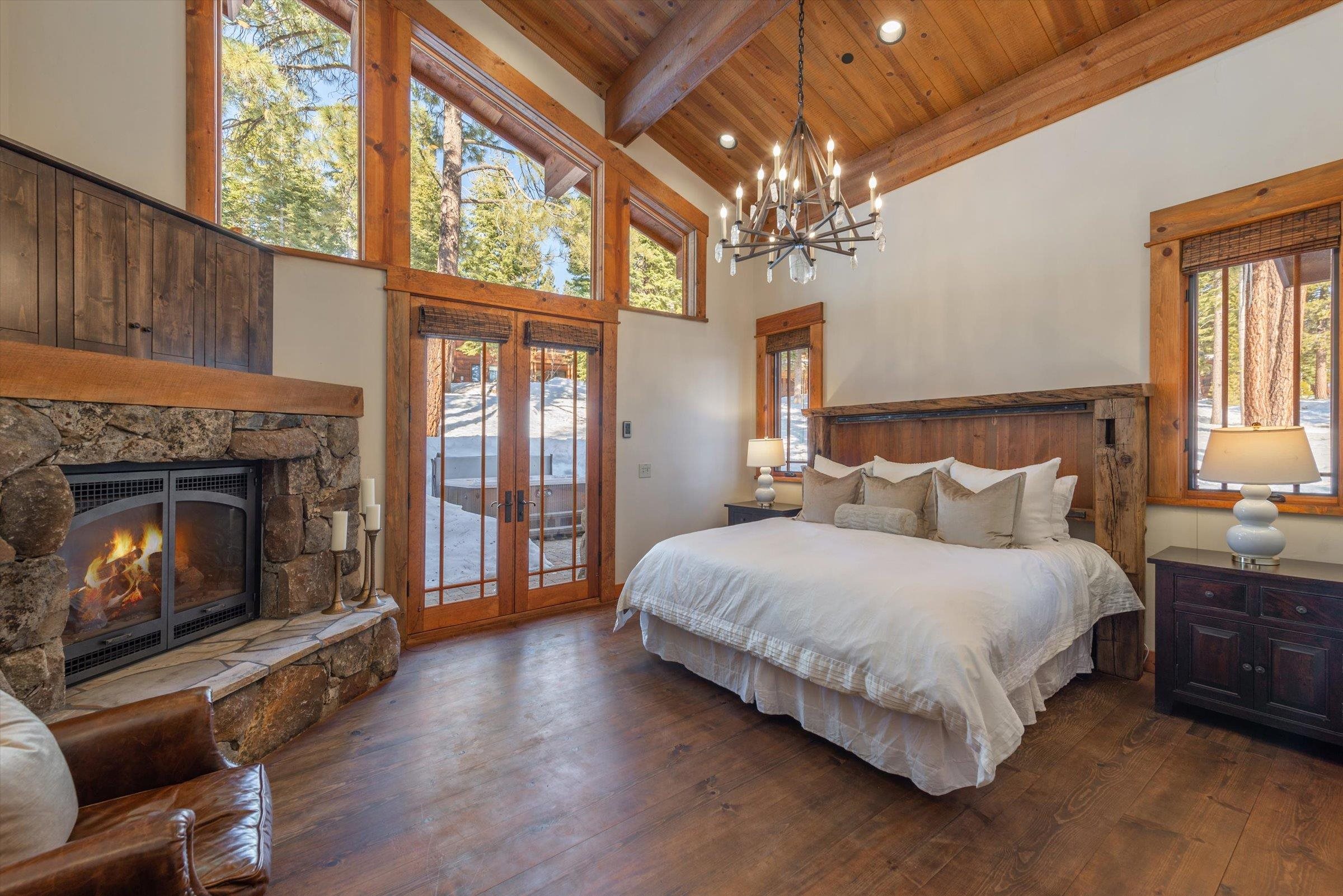 1756 Grouse Ridge Road Truckee, CA 96161 - Photo 8 of 21 a spacious bedroom with a bed and a fireplace