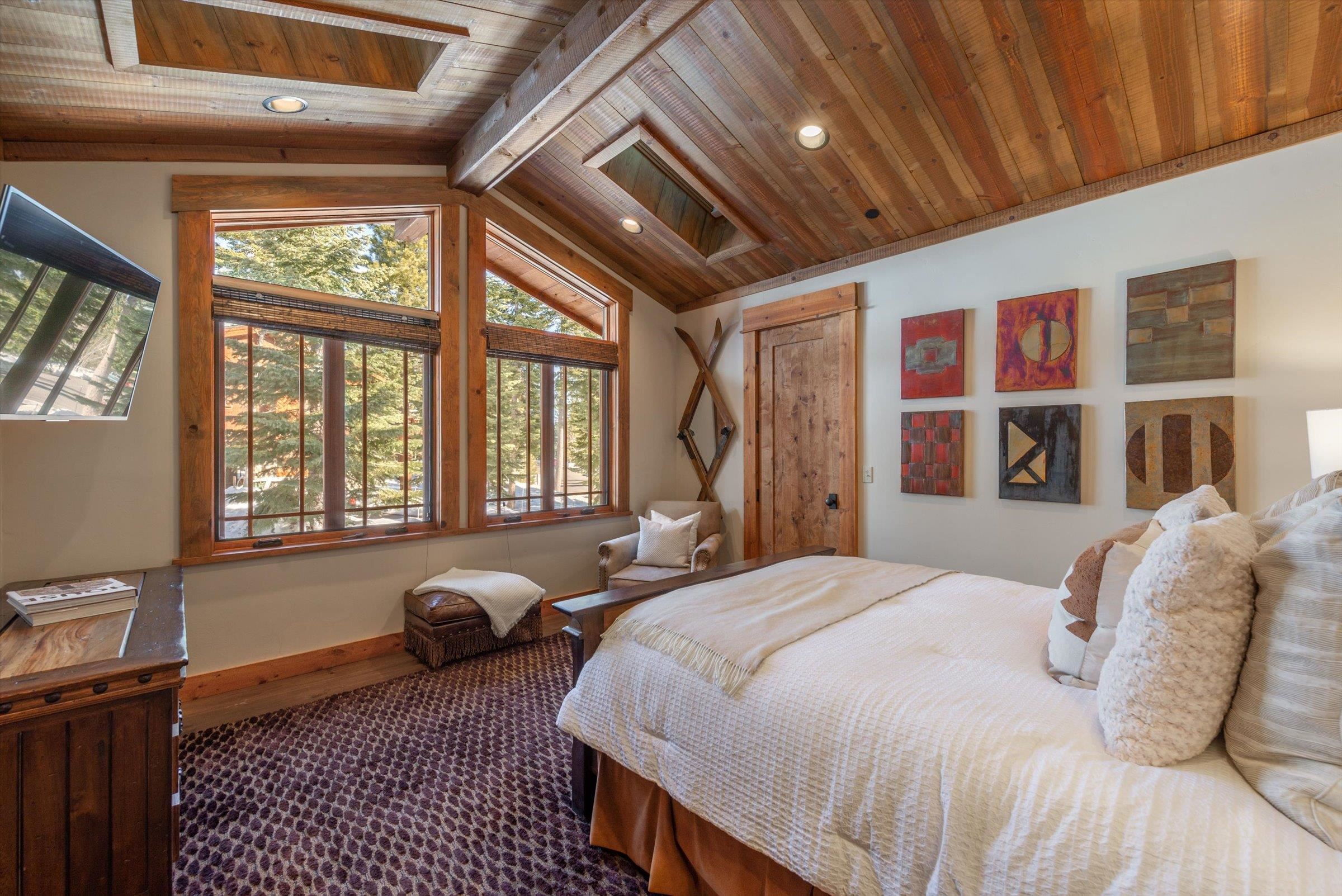 1756 Grouse Ridge Road Truckee, CA 96161 - Photo 10 of 21 a spacious bedroom with a bed and wooden floor