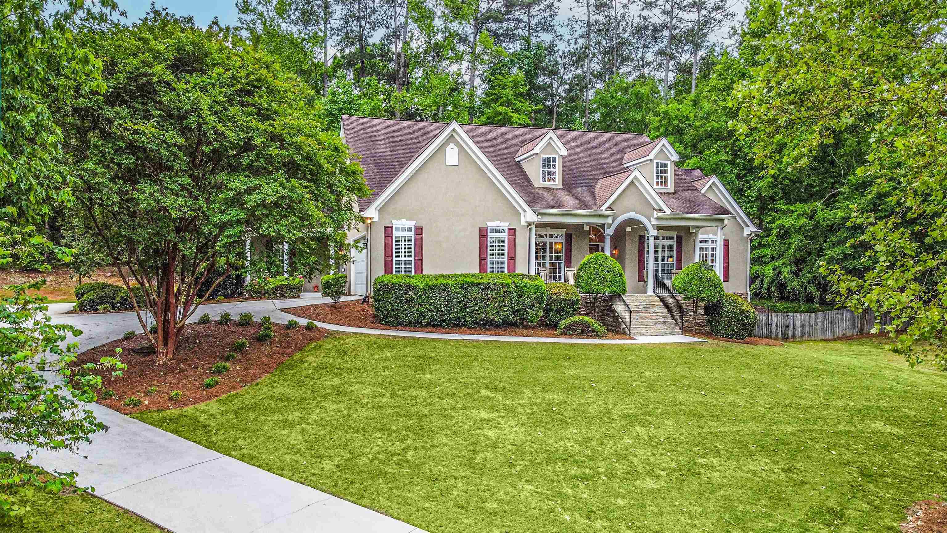 90 Cornish Trace Drive Covington, GA 30014 - Photo 1 of 1 a house with a big yard and large trees