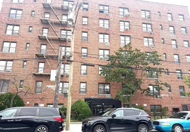 a view of a cars parked in front of a building