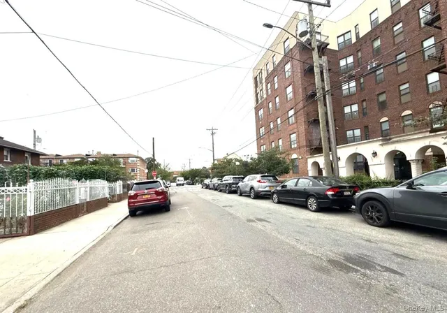 a view of street with parked cars