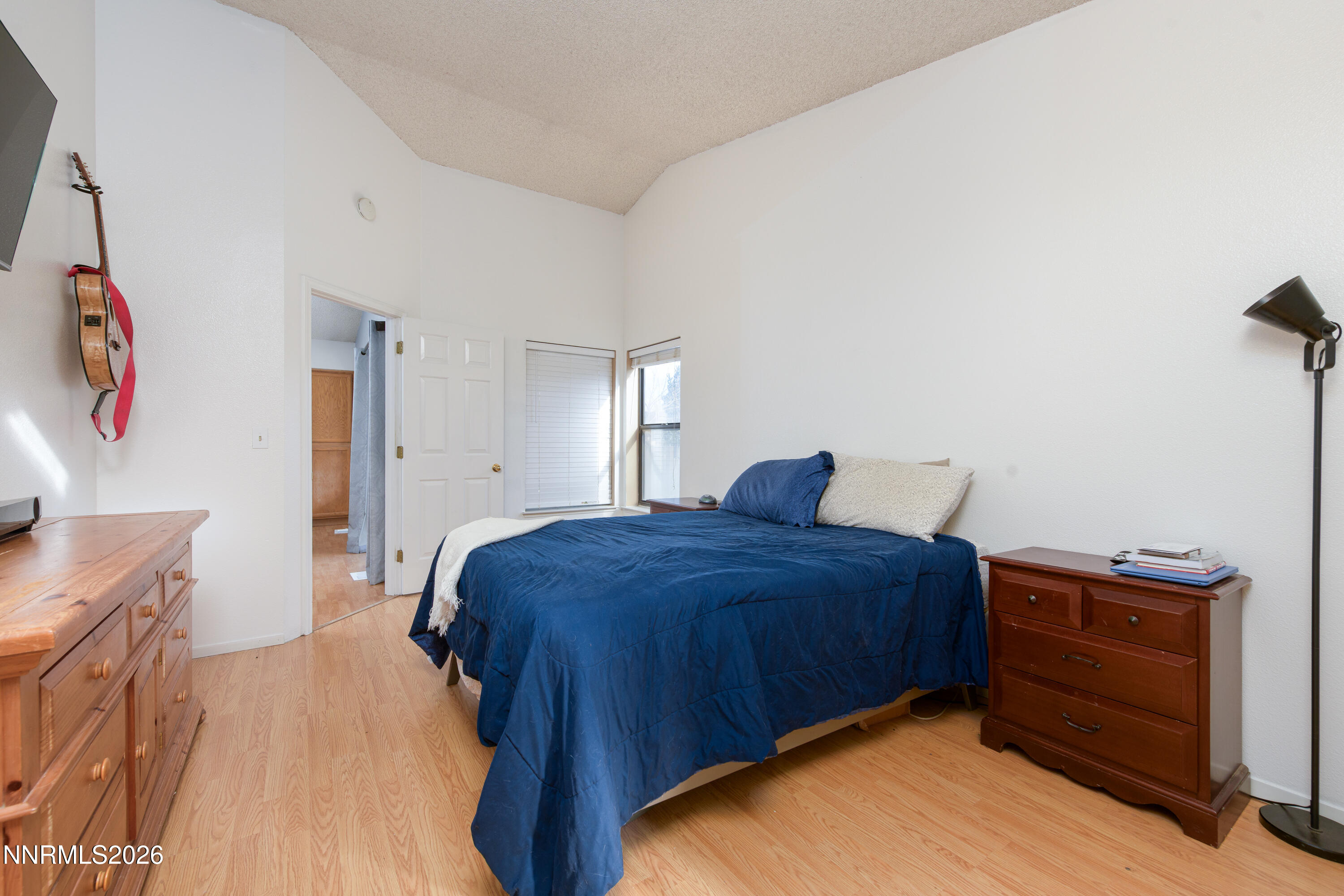 1352 Leonard Road Gardnerville, NV 89460 - Photo 12 of 23 a bedroom with a bed and a desk
