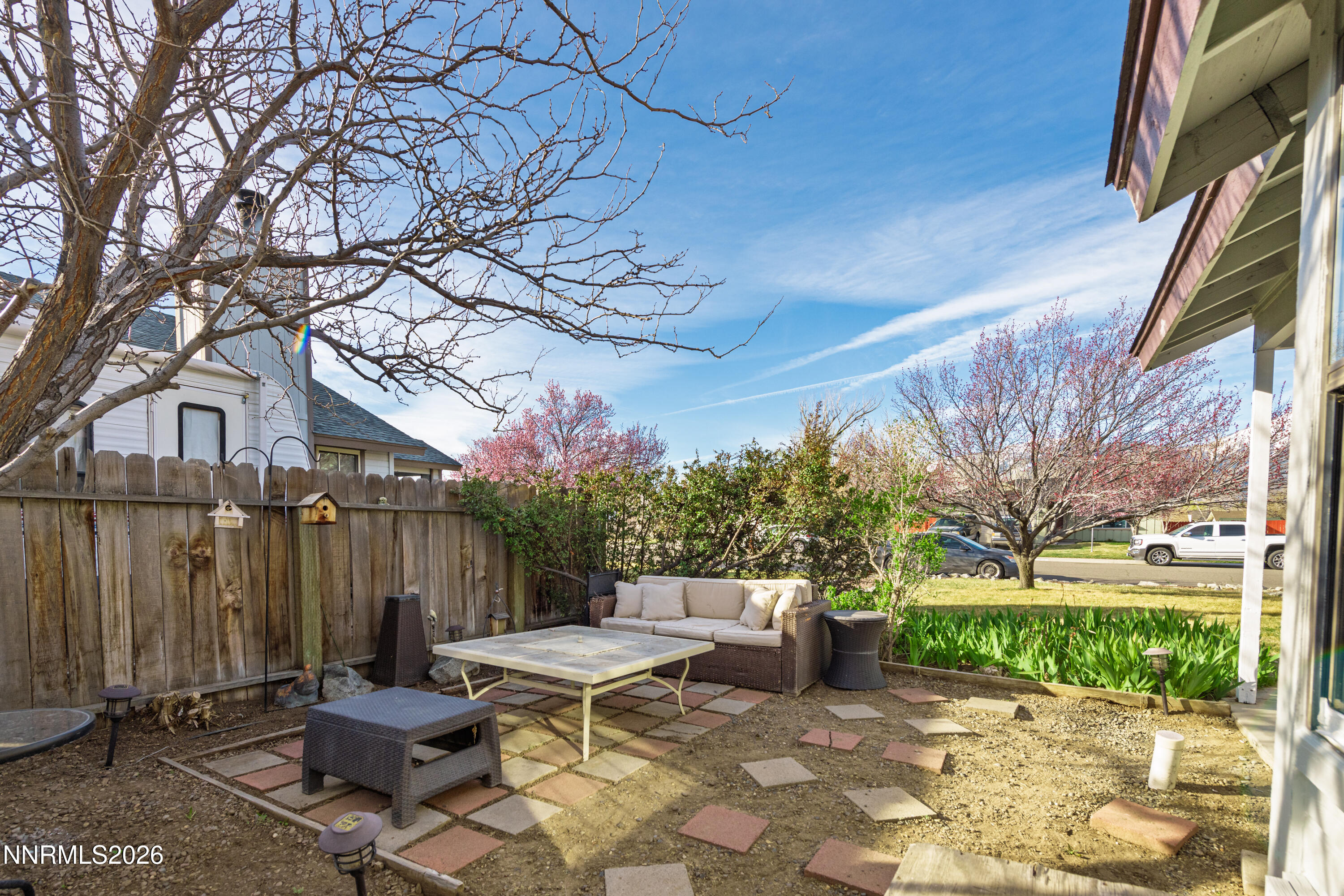 1352 Leonard Road Gardnerville, NV 89460 - Photo 3 of 23 a view of backyard with a table and chairs