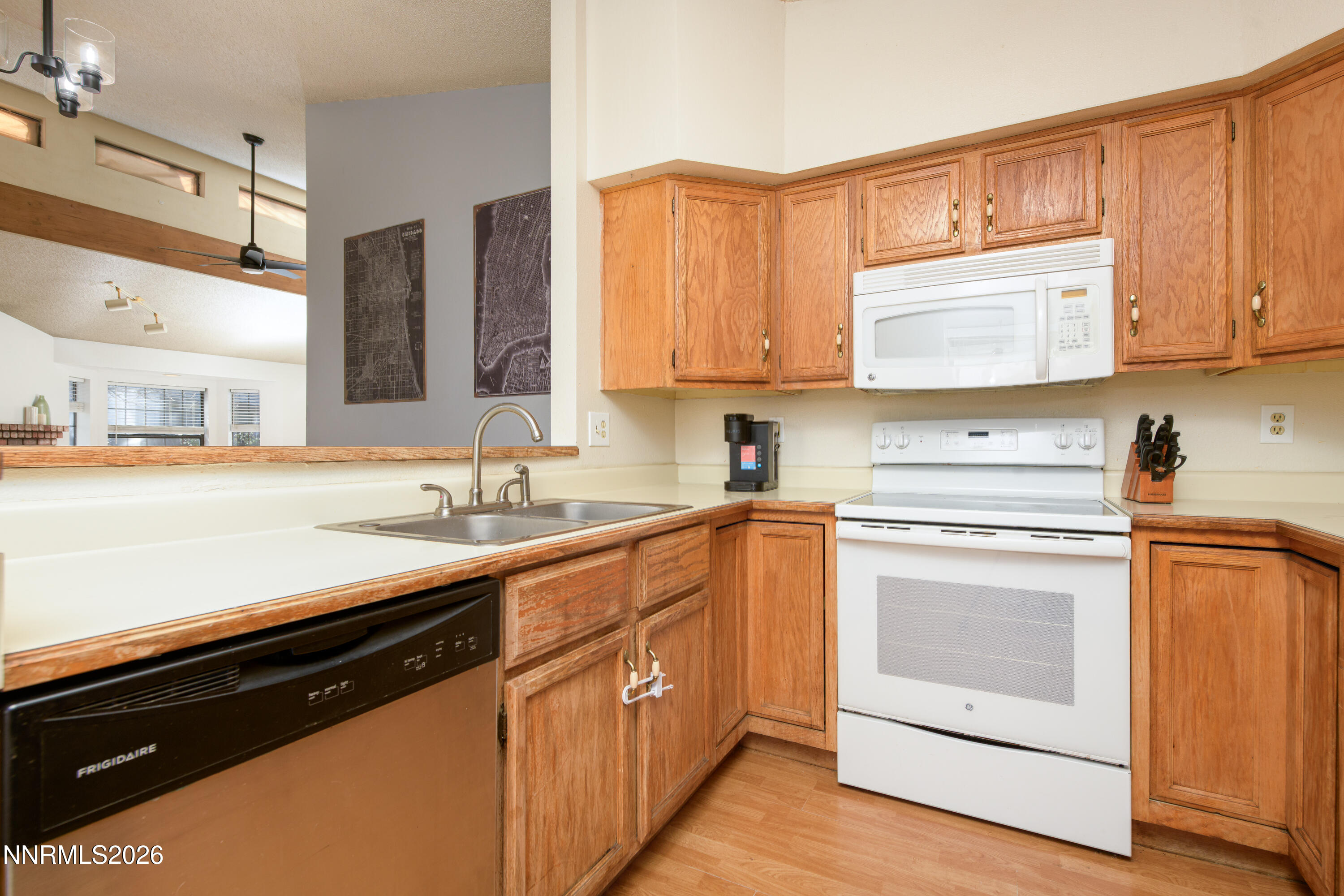 1352 Leonard Road Gardnerville, NV 89460 - Photo 8 of 23 a kitchen with stainless steel appliances granite countertop a sink stove and cabinets