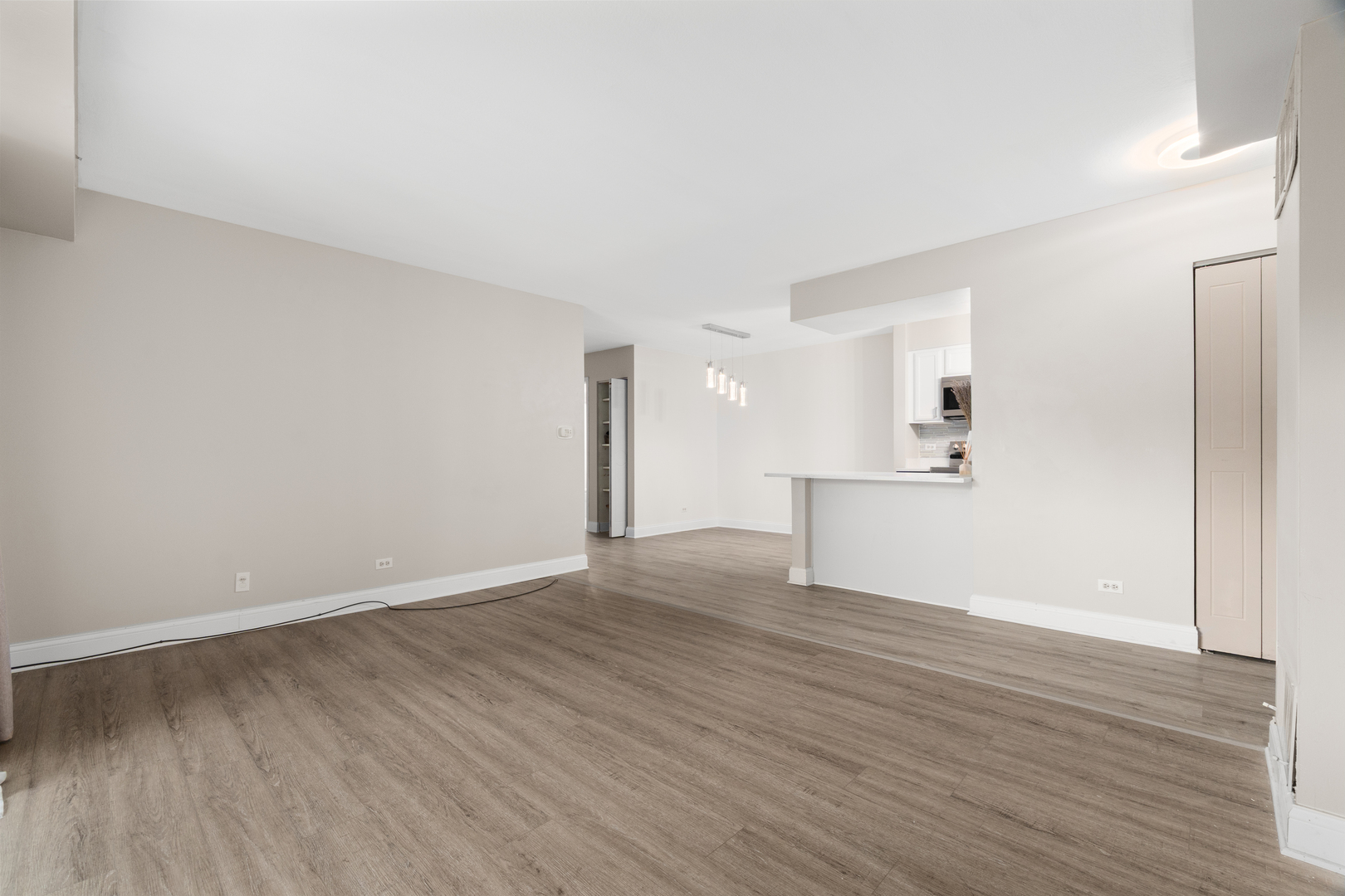 808 North River Road, Unit 2A Mount Prospect, IL 60056 - Photo 7 of 22 a view of empty room with wooden floor