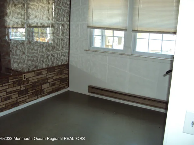 a view of a small space with wooden floor