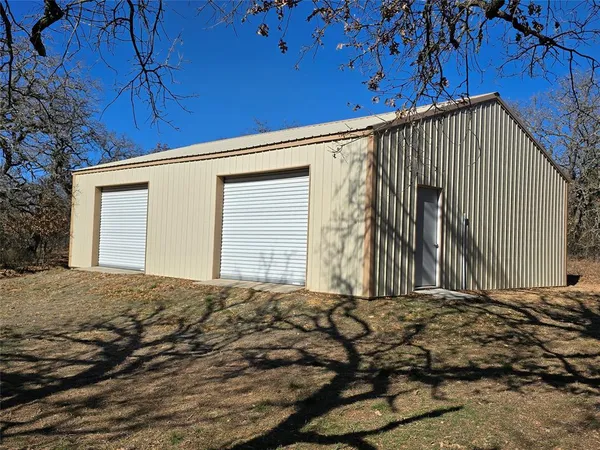 a view of a house with a street
