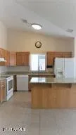 a kitchen with stainless steel appliances a sink stove and cabinets