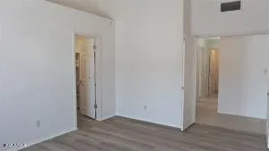 a bathroom with a granite countertop sink a toilet and a shower
