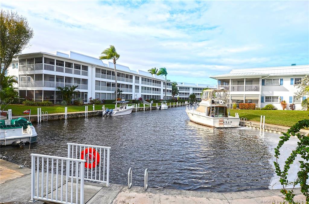1852 Southwest Palm City Road, Unit 201 Stuart, FL 34994 - Photo 28 of 34 a view of pool with outdoor seating