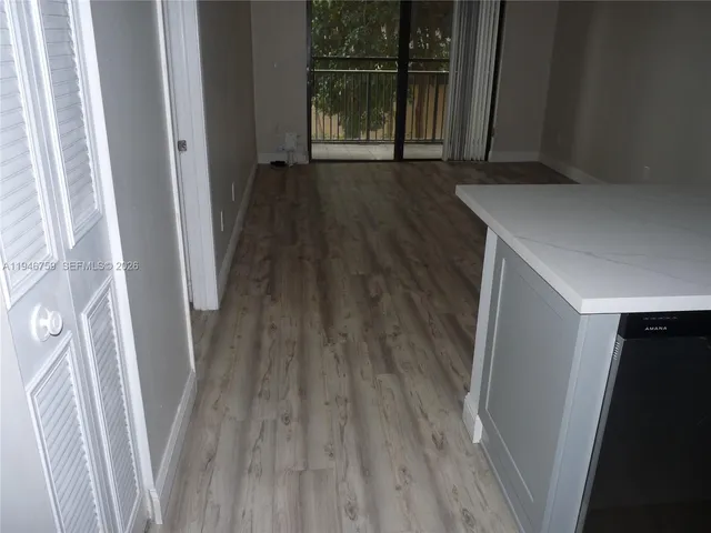 a view of balcony with wooden floor