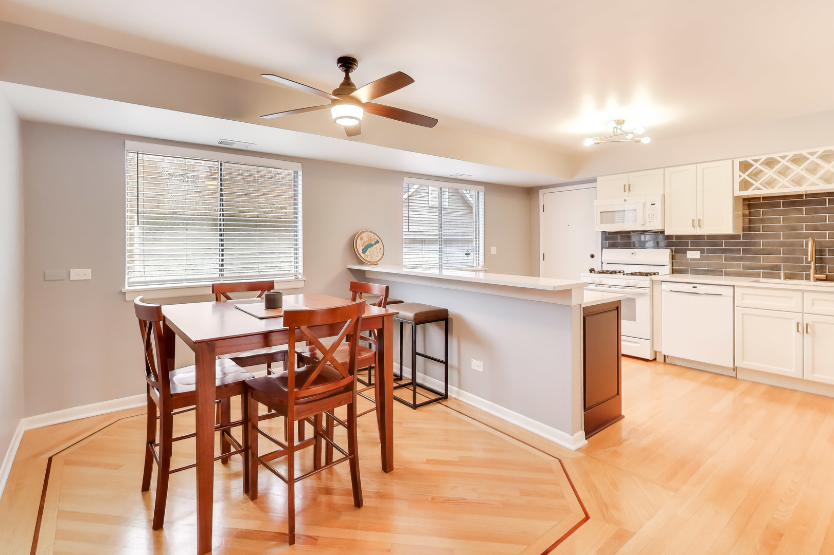 6820 West Raven Street, Unit 1B Chicago, IL 60631 - Photo 13 of 25 a view of a dining room with furniture and a window