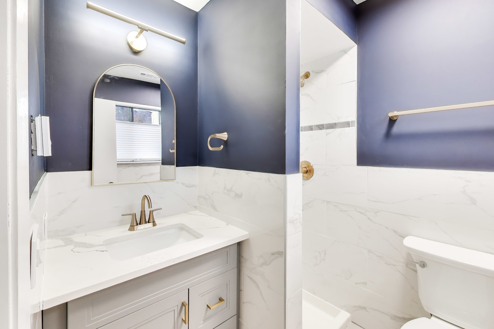 6820 West Raven Street, Unit 1B Chicago, IL 60631 - Photo 16 of 25 a bathroom with a sink and a mirror