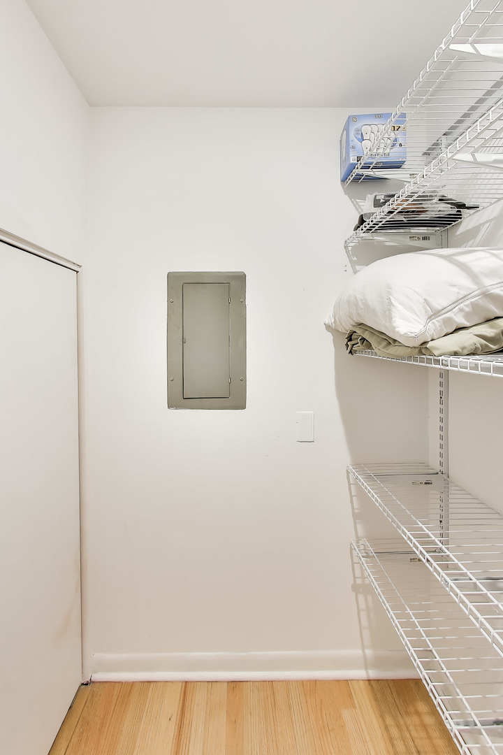 6820 West Raven Street, Unit 1B Chicago, IL 60631 - Photo 19 of 25 a view of a room with racks on the wall