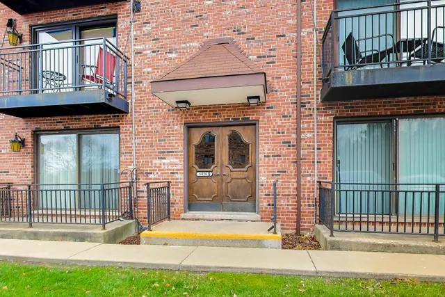a view of front door of house with stairs