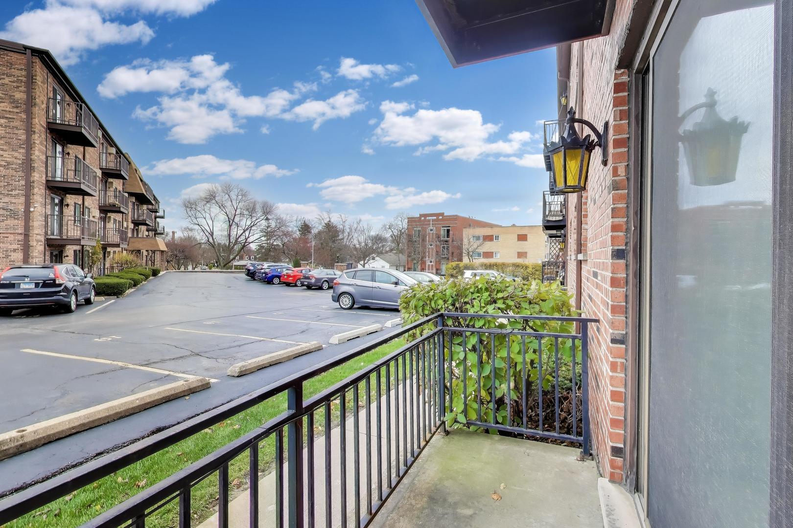 6820 West Raven Street, Unit 1B Chicago, IL 60631 - Photo 5 of 25 a view of city from balcony