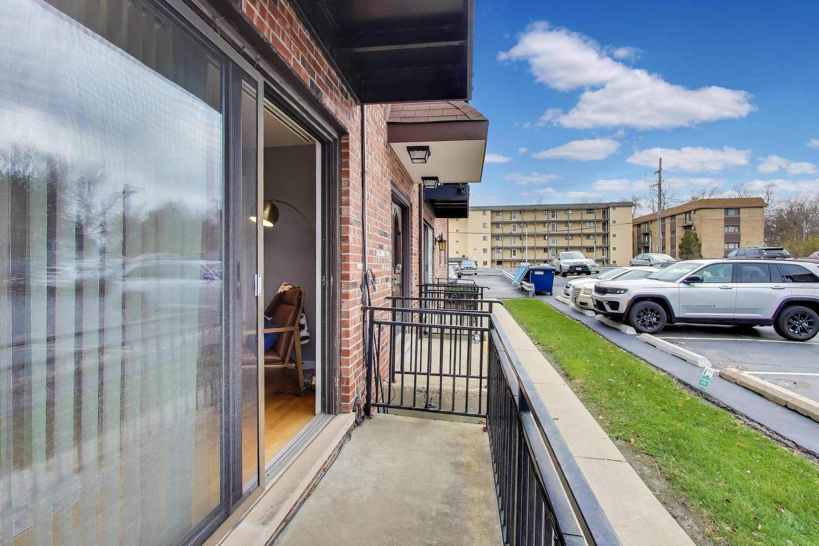 6820 West Raven Street, Unit 1B Chicago, IL 60631 - Photo 6 of 25 a view of a car parked in front of a building