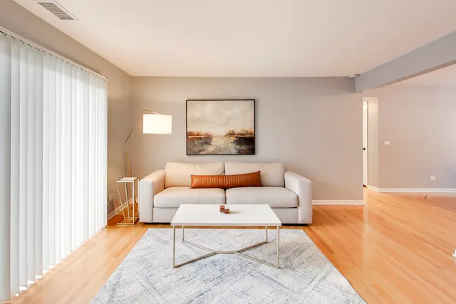 a living room with a couch and a large window