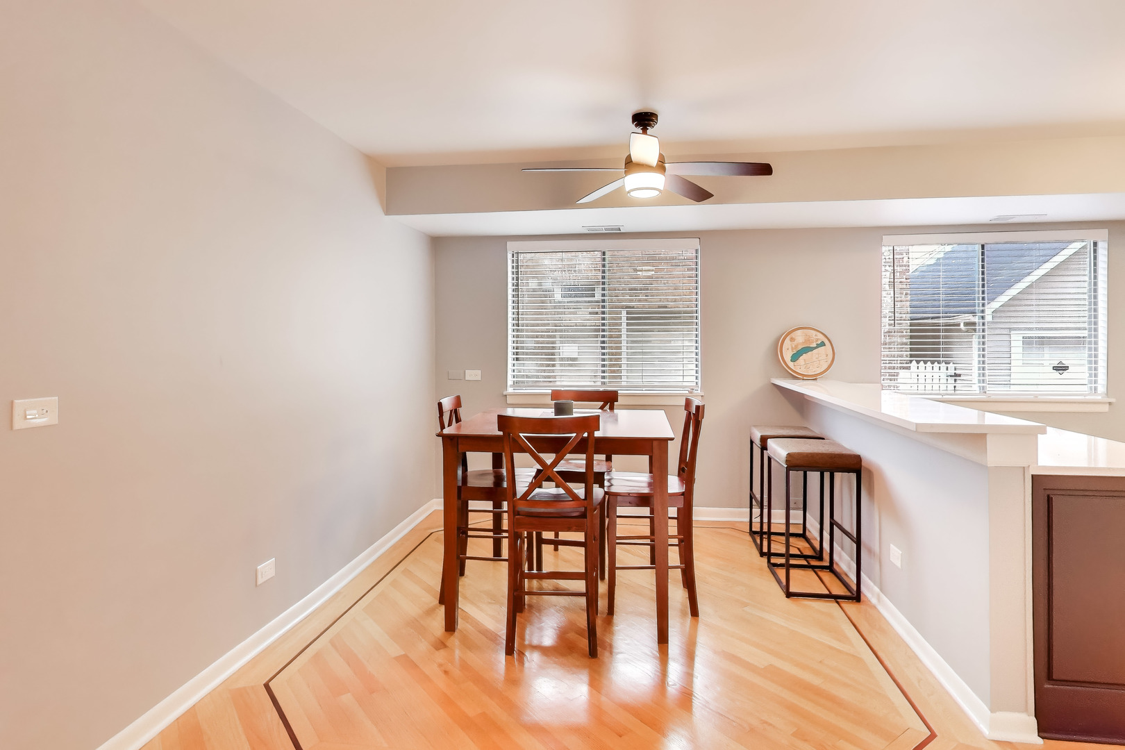 6820 West Raven Street, Unit 1B Chicago, IL 60631 - Photo 9 of 25 a dining room with furniture and window