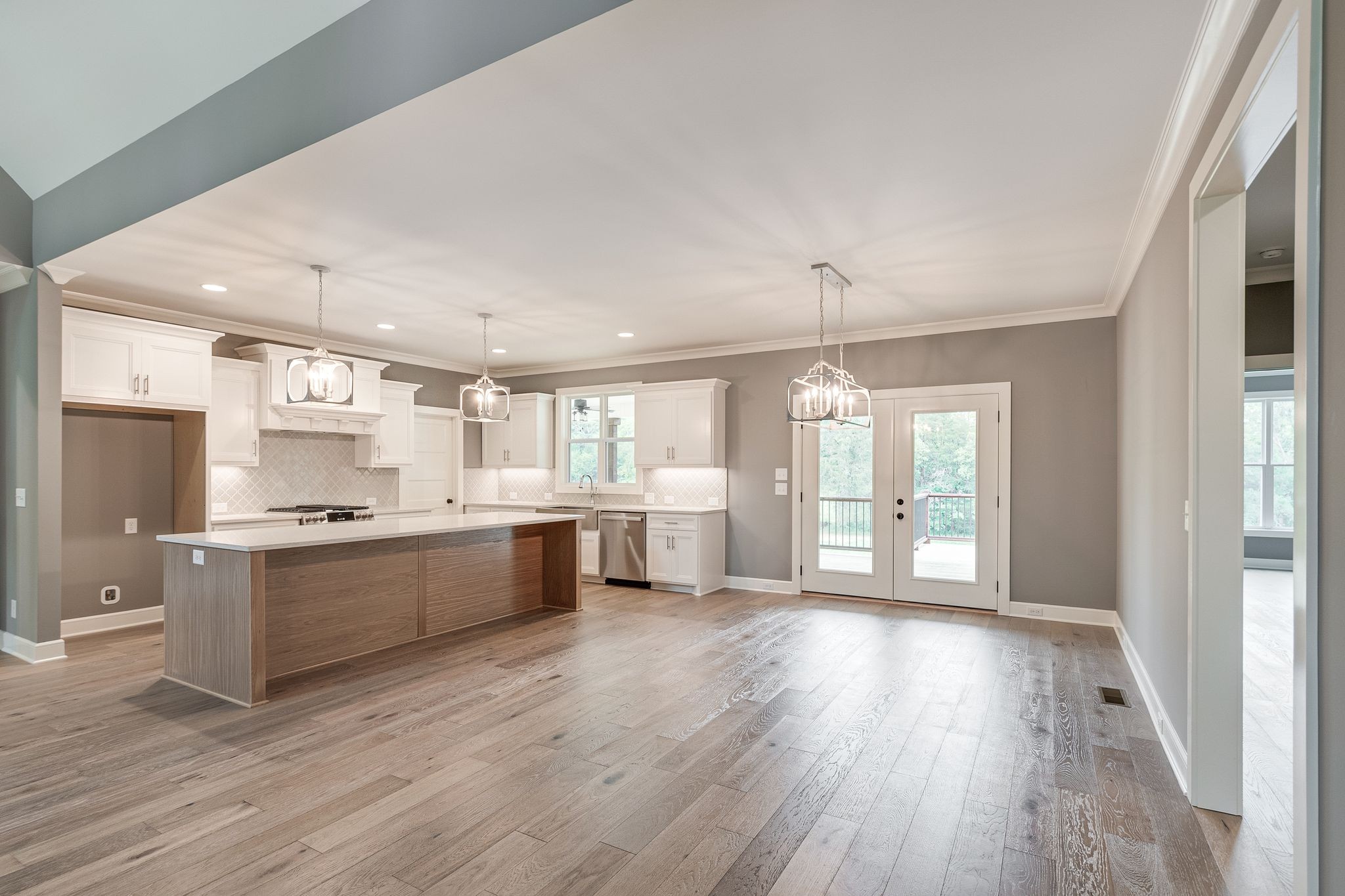 1581 Phillips Road Lebanon, TN 37087 - Photo 11 of 36 a large kitchen with a wooden floor and large windows