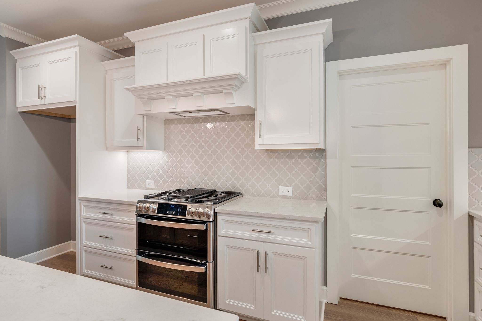 1581 Phillips Road Lebanon, TN 37087 - Photo 14 of 36 a kitchen with white cabinets and white appliances