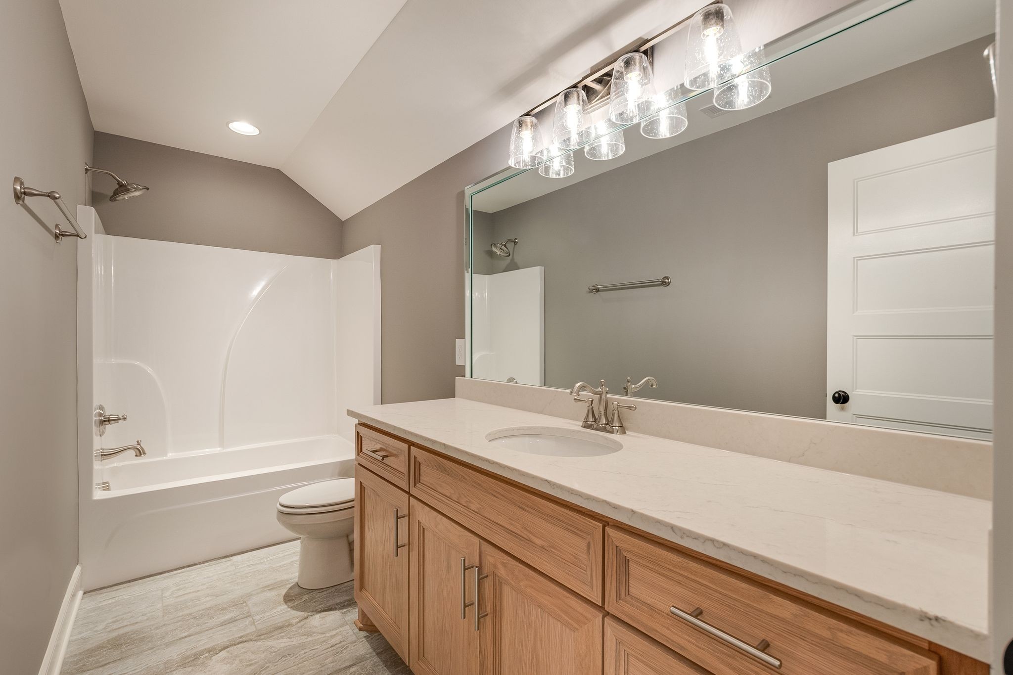 1581 Phillips Road Lebanon, TN 37087 - Photo 34 of 36 a bathroom with a sink a toilet and a bathtub