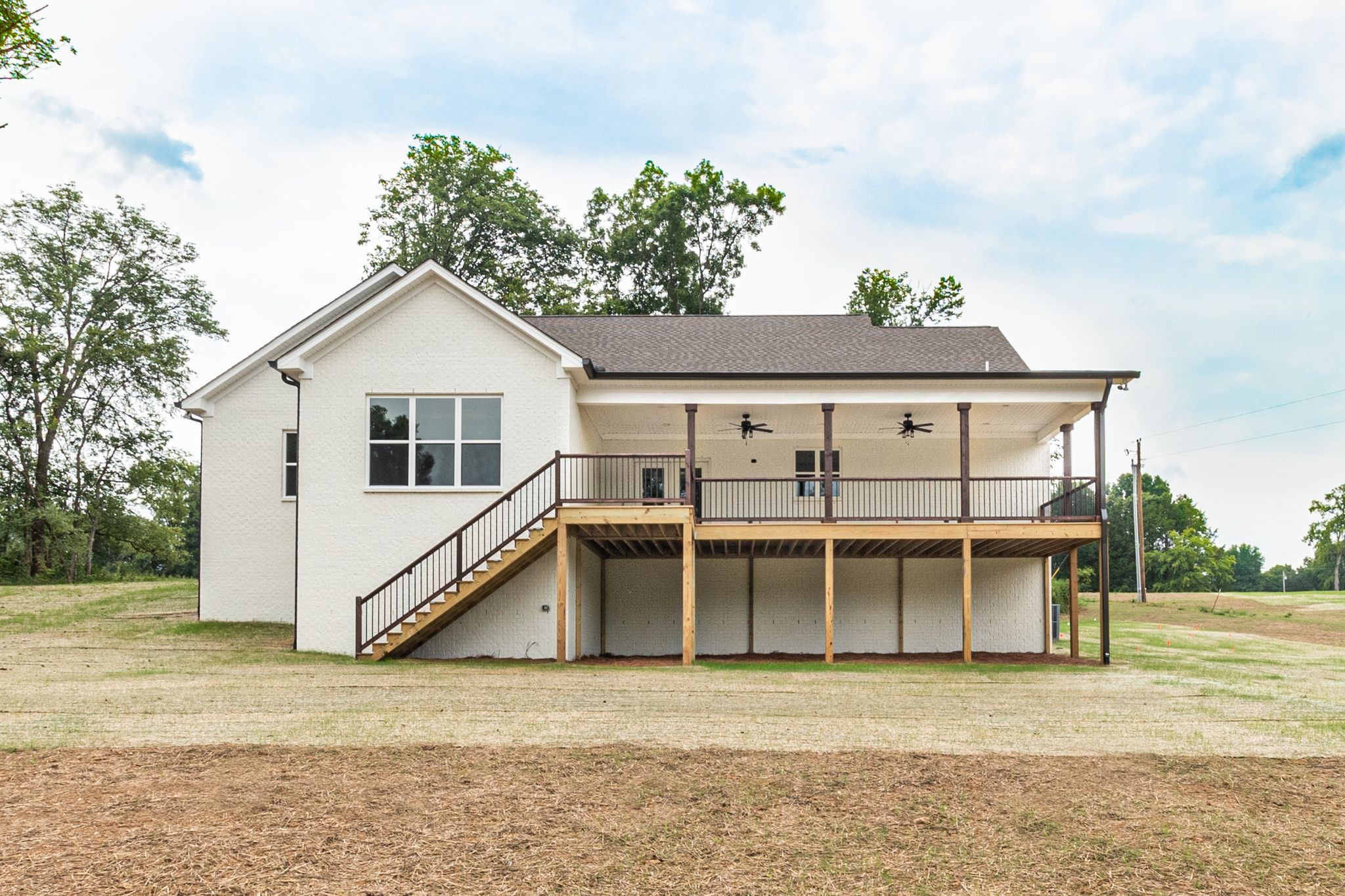 1581 Phillips Road Lebanon, TN 37087 - Photo 35 of 36 a view of a white house with a yard and balcony