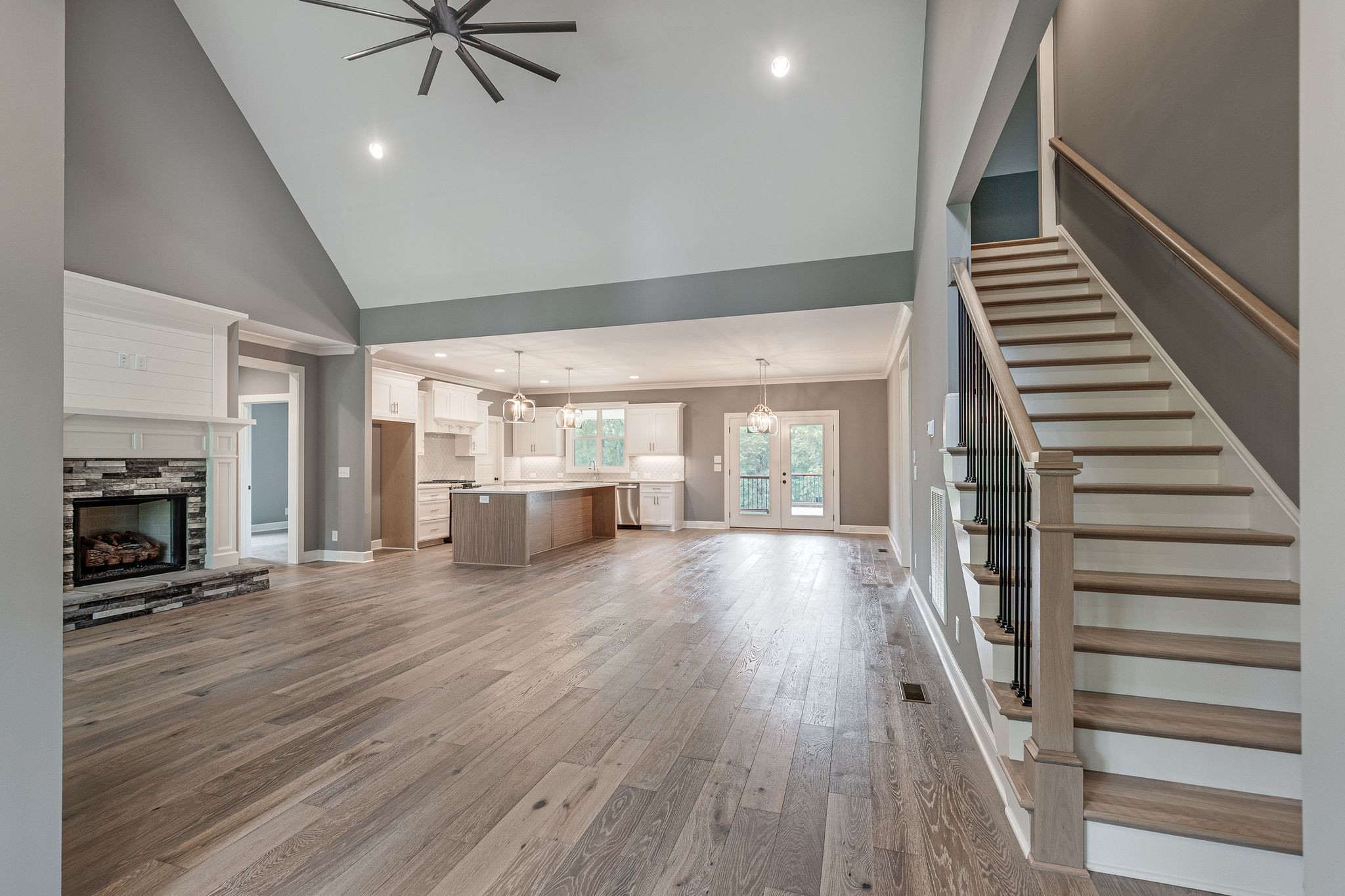 1581 Phillips Road Lebanon, TN 37087 - Photo 5 of 36 a view of a livingroom with wooden floor fireplace and staircase