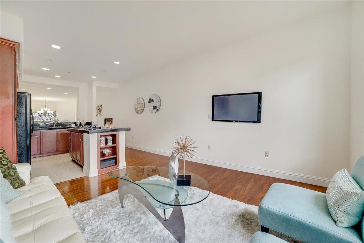 49030 Meadowfaire Common Fremont, CA 94539 - Photo 13 of 52 a living room with furniture and kitchen view