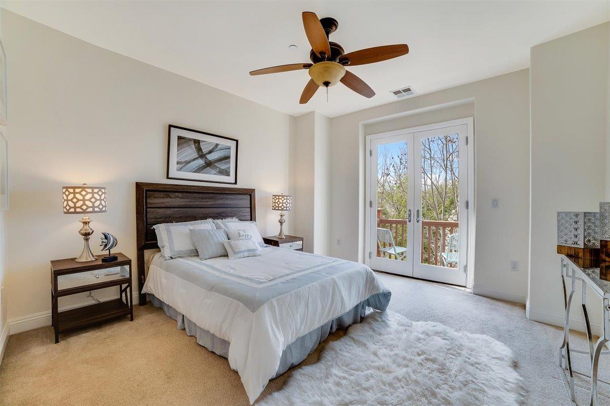 49030 Meadowfaire Common Fremont, CA 94539 - Photo 6 of 52 a bedroom with a large bed and a window