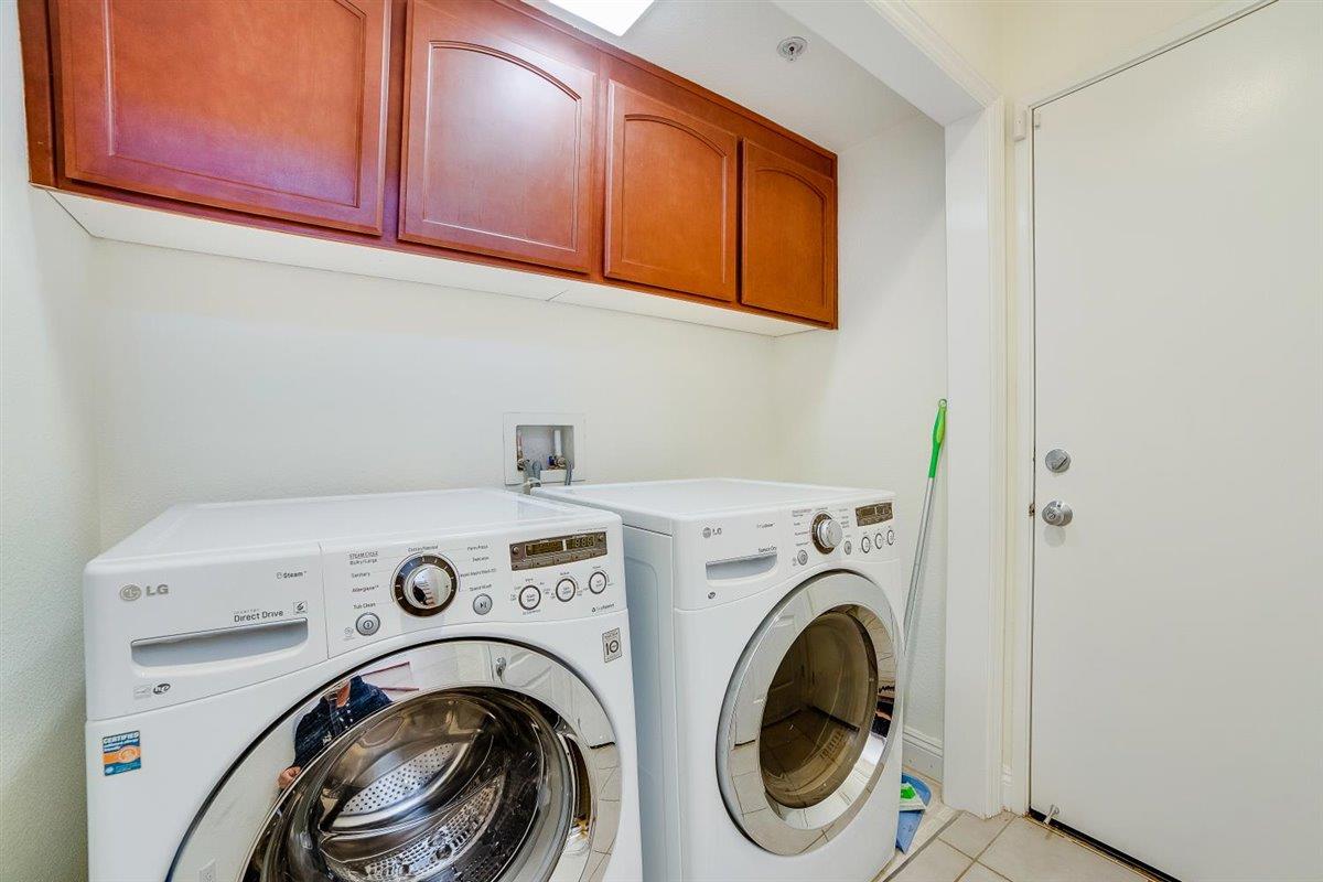 49030 Meadowfaire Common Fremont, CA 94539 - Photo 9 of 52 a utility room with dryer and washer