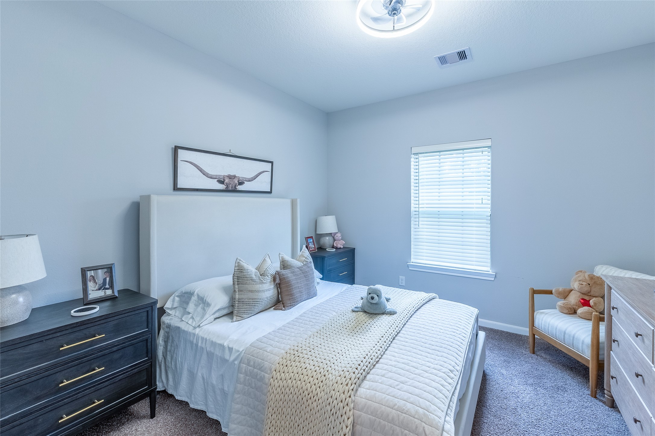 120 Sanctuary Road Huntsville, TX 77340 - Photo 18 of 38 a bedroom with a bed and a window