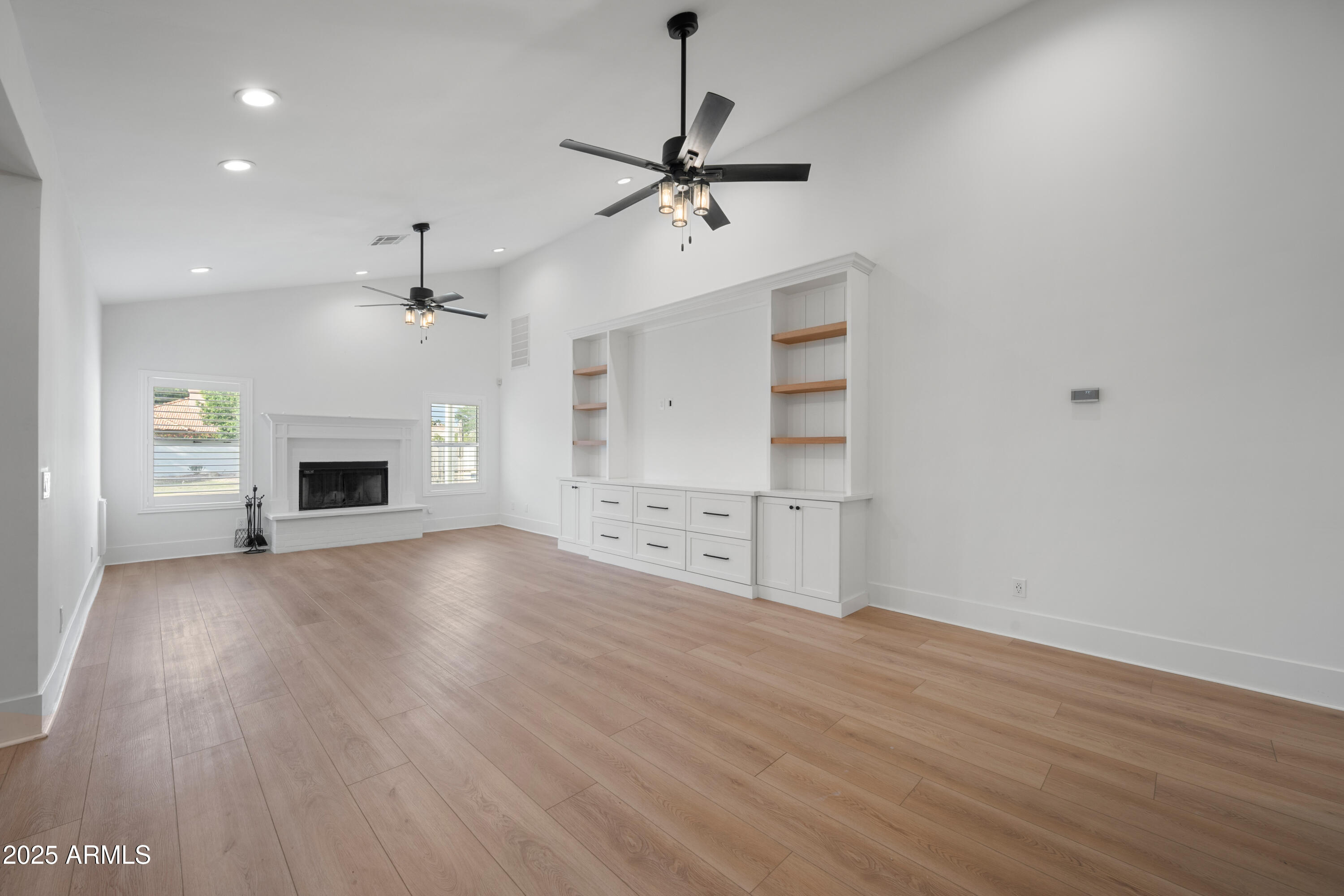 4352 East Santa Rosa Place Gilbert, AZ 85234 - Photo 12 of 53 an empty room with windows and fireplace