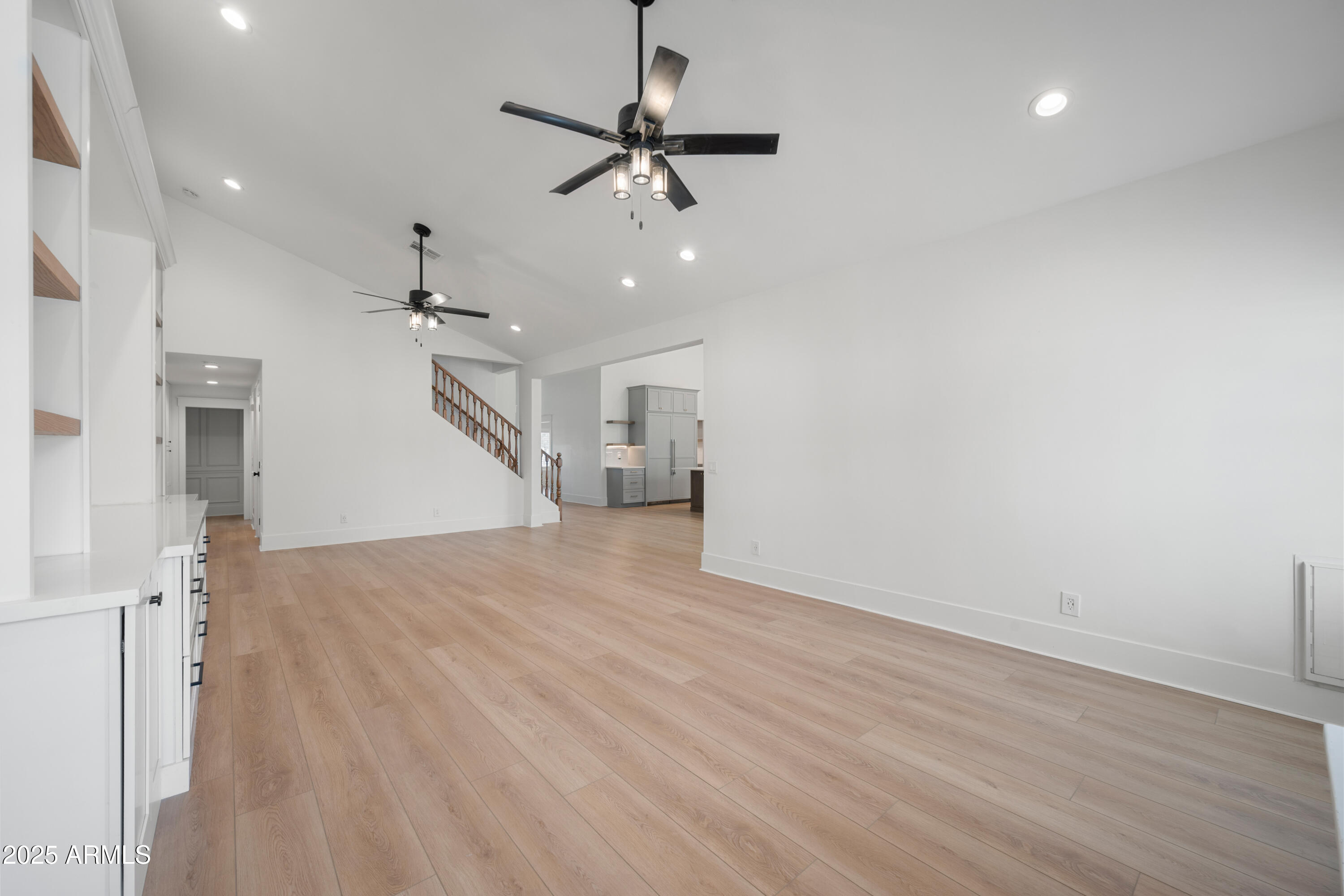 4352 East Santa Rosa Place Gilbert, AZ 85234 - Photo 13 of 53 a view of empty room with wooden floor and ceiling fan