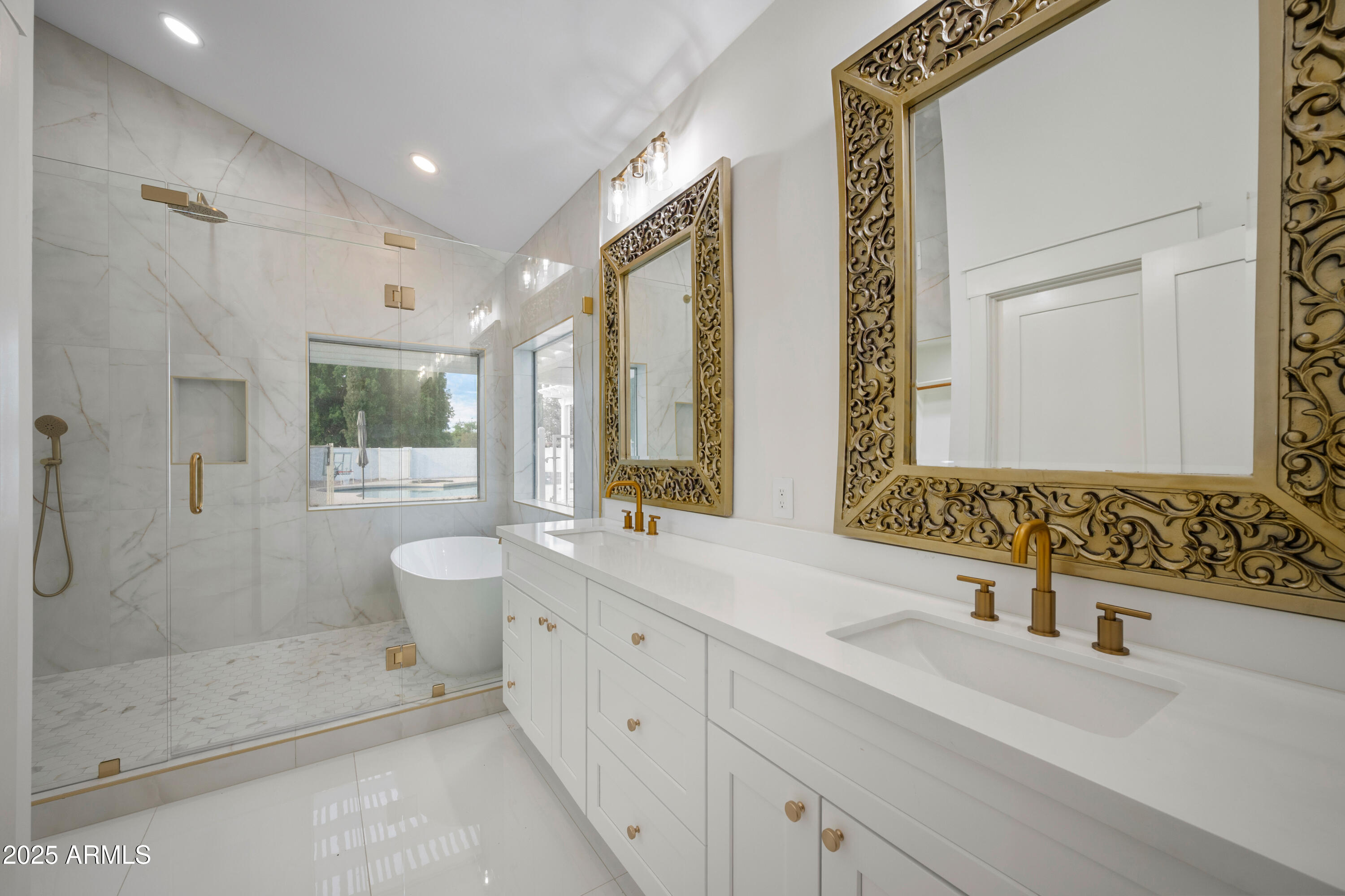 4352 East Santa Rosa Place Gilbert, AZ 85234 - Photo 16 of 53 a spacious bathroom with a double vanity sink toilet and shower