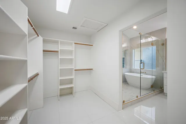 a bathroom with a shower and a sink