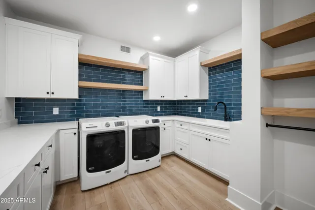 a kitchen with stainless steel appliances cabinets and a sink