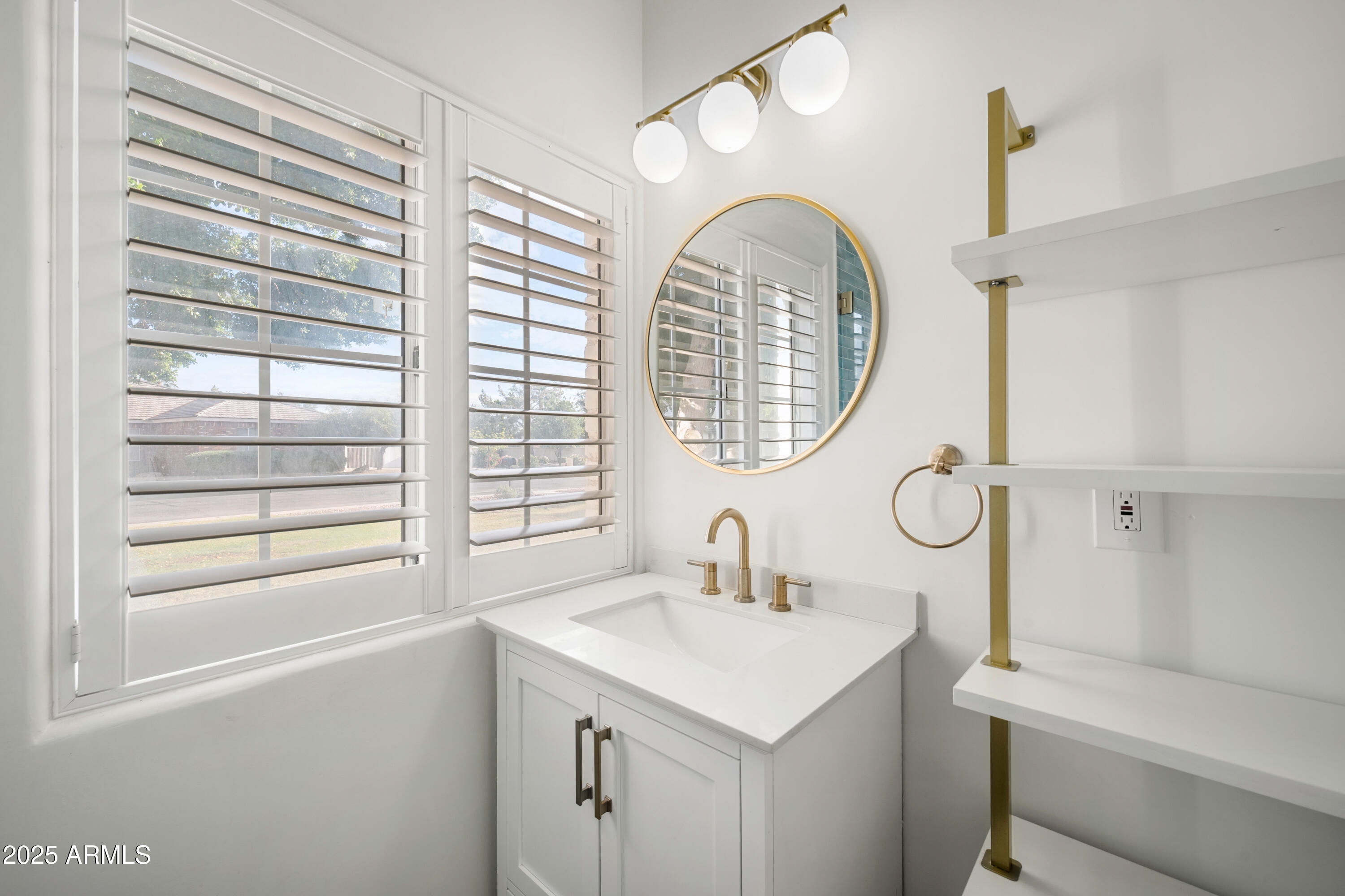 4352 East Santa Rosa Place Gilbert, AZ 85234 - Photo 28 of 53 a bathroom with a sink and a mirror