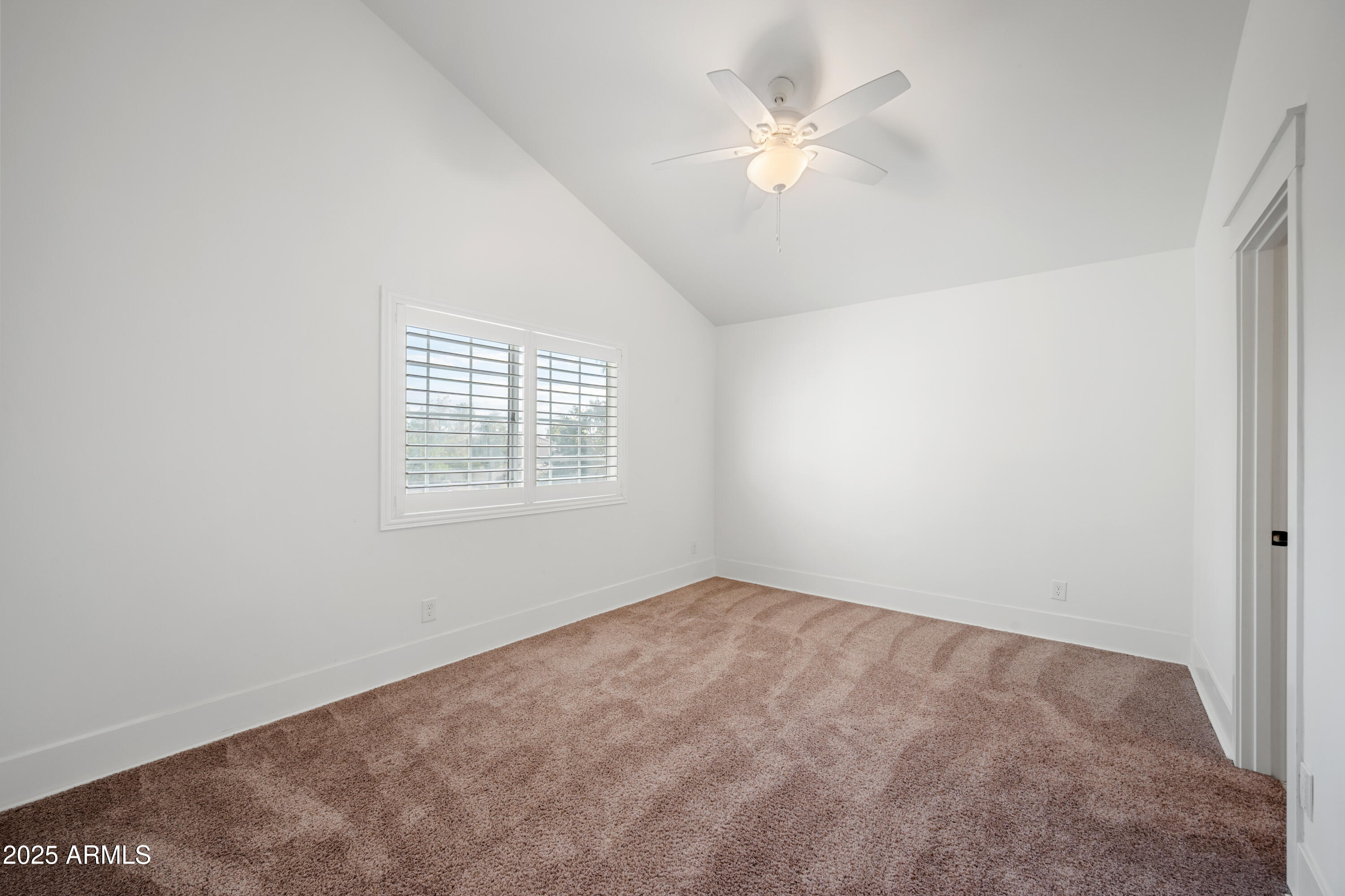 4352 East Santa Rosa Place Gilbert, AZ 85234 - Photo 32 of 53 an empty room with windows and fan