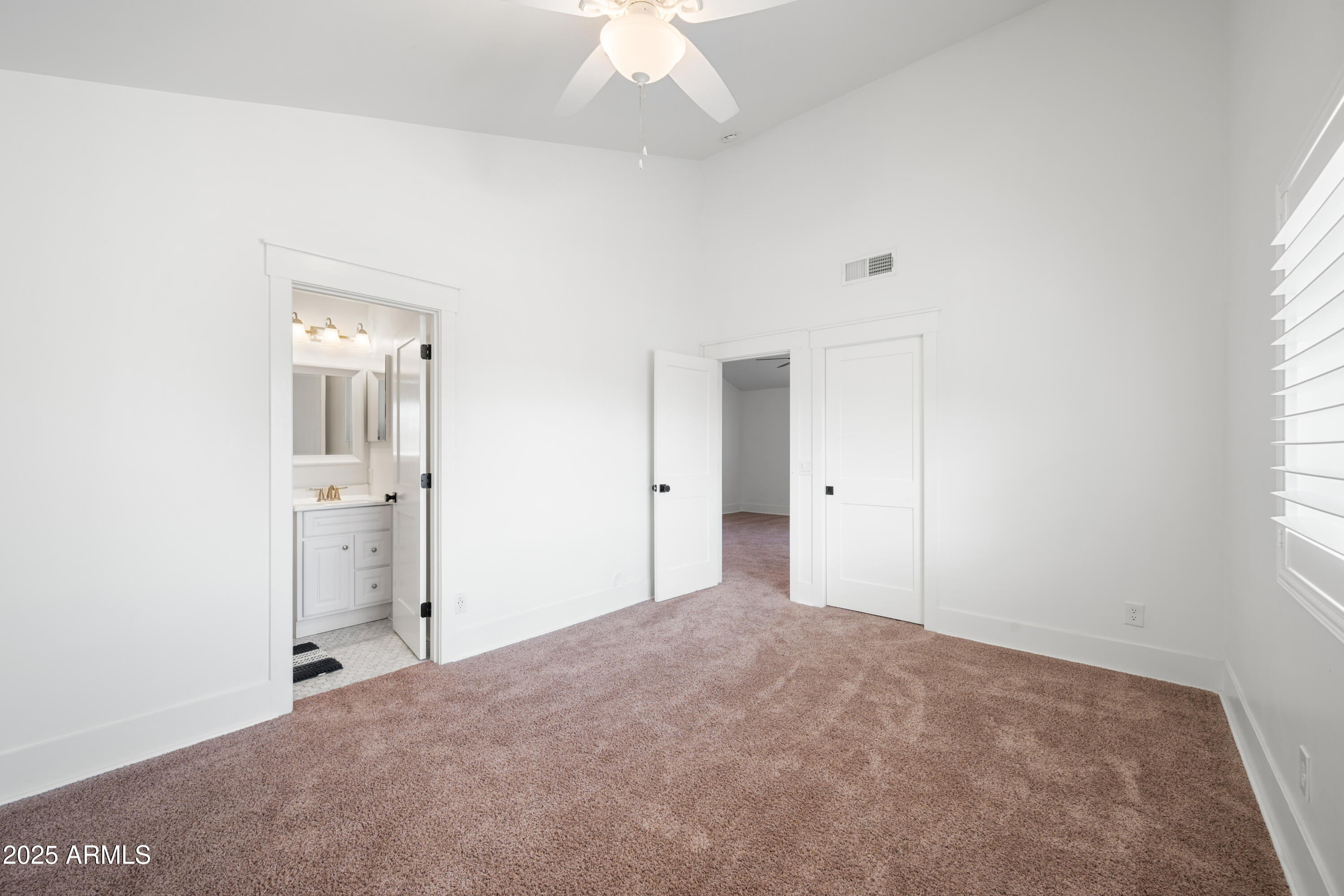 4352 East Santa Rosa Place Gilbert, AZ 85234 - Photo 33 of 53 a view of a big room with windows and chandelier fan